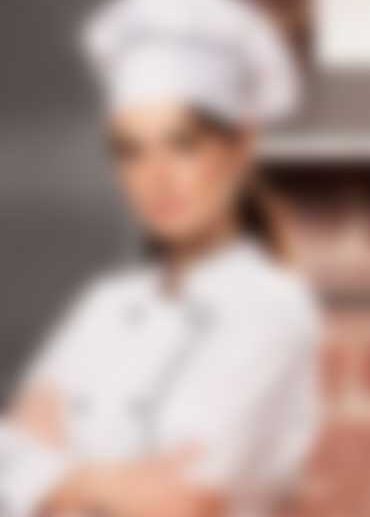 A chef in a white uniform and hat stands with arms crossed against a blurred kitchen background, embodying the confidence of a Singles Cooking Club leader. The focus is on the chef's attire and poised posture.